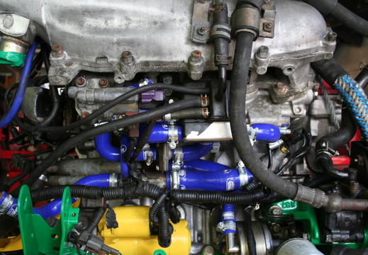 water hoses (blue) & starter motor (yellow)